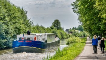 Passengers on deck and walking tow path, Finesse, Canal du Centre, Rully to Fragnes, Burgundy, France, May 2016